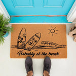 Probably at the beach doormat featuring surfboards and ocean waves, this natural coir welcome mat is a fun outdoor floor rug for a coastal home entrance, perfect for summer decor and beach house entryway floor mats for guests.
