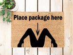 Funny doormat with text Place package here and a graphic of legs in high heels, this natural coir welcome mat is a humorous front porch decor piece for delivery drivers and guests, perfect for a cheeky home entrance or apartment
