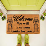 Nutcracker welcome doormat for front porch decor, featuring a funny holiday message and two soldier figures on natural coir fiber.
