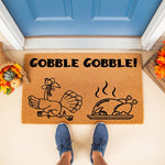 Thanksgiving turkey doormat with a funny Gobble Gobble design featuring a cartoon turkey and a cooked roast, perfect for fall porch decor, autumn welcome mat, and seasonal home entrance floor mats for the holiday season.