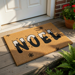 Noel Christmas doormat with a festive winter design featuring black letters topped with snow and small snowflakes on a natural coir fiber welcome mat, perfect for holiday porch decor and seasonal entryway floor mats.