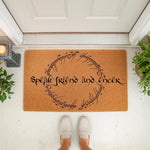 Fantasy quote doormat featuring the text Speak Friend and Enter in a circular script design on a natural coir welcome mat, perfect for a front porch entrance, home decor, or a housewarming gift for fans of epic adventure stories.
