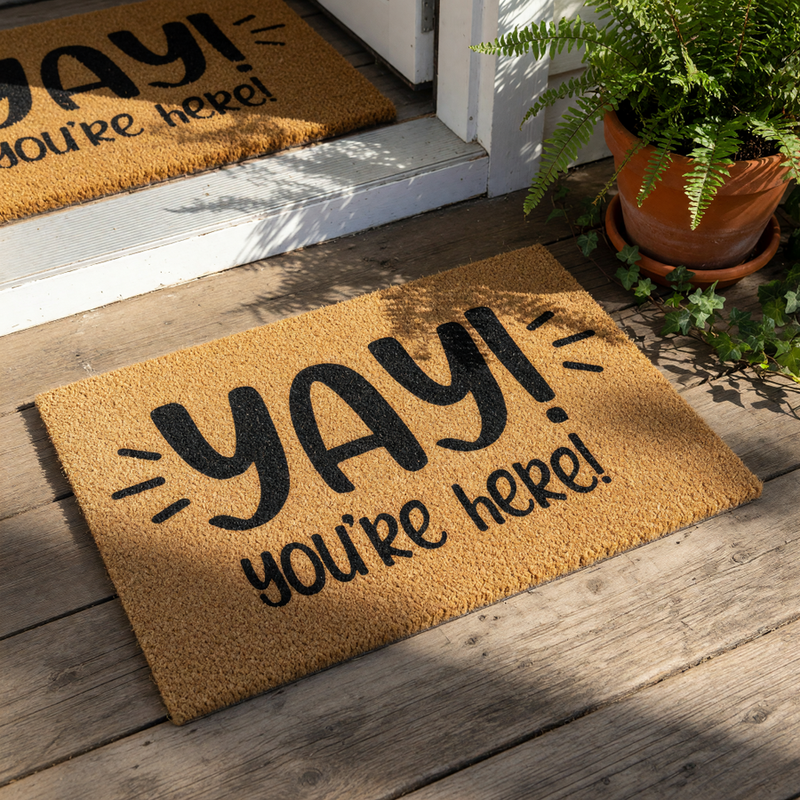 Yay You Are Here coir doormat with black text on a natural fiber rug, this funny welcome mat for front porch entryways features a cheerful greeting design that makes a stylish housewarming decor piece for any home entrance.