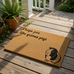 Guinea pig doormat with a funny quote that says I hope you like guinea pigs, featuring a cute illustration of a small pet on a natural coir fiber welcome mat for animal lovers and home entry decor for pet owners.