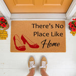 There's No Place Like Home doormat featuring red shoes, a natural coir welcome mat for your front porch decor, perfect for movie fans who want a fun, stylish entrance rug that adds a touch of classic charm to any house or