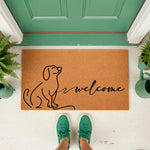 Dachshund welcome doormat featuring a minimalist line art dog design on natural coir fiber, perfect for a front porch entryway.