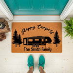 Personalized Happy Campers doormat featuring a travel trailer and pine trees, this custom outdoor welcome mat is a durable coir rug for camping enthusiasts and makes a great housewarming decor piece for any front porch or camper