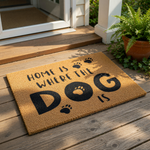 A textured doormat with the phrase "Home is where the dog is" printed on it.