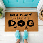 a door mat that says home is where the dog is