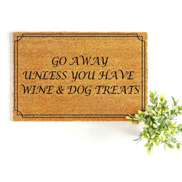 Funny Go Away Unless You Have Wine and Dog Treats doormat made of natural coir fiber, featuring a black border and bold text for a humorous front porch welcome mat that is perfect for any dog lover or wine enthusiast home decor.