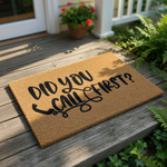 A textured doormat with the text "Did you call first?" printed on it.