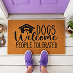 a door mat that says dogs welcome people tolerrated