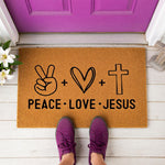 a door mat that says peace love jesus