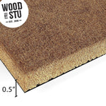 a close-up of a straw mat or straw-like material, with the text "WOOD BY STU" prominently displayed above it.
