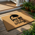A holiday-themed doormat with a Santa hat and the text "HO HO HOME FOR THE HOLIDAYS" printed on it, along with some wrapped gifts and a pair of boots.