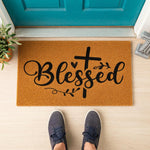 a door mat with the words, blessing and a cross on it