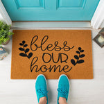 a door mat that says, bless our home