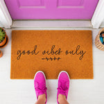 a door mat that says, good vibes only