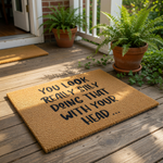 A textured area rug with a humorous message printed on it.