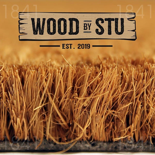 a close-up of a straw mat or straw-like material, with the text "WOOD BY STU" prominently displayed above it.