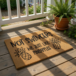 A textured area rug with a humorous message printed on it.