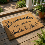 A welcome mat with the text "Bienvenidos a la casa de la Abuela & Abuelo" written on it.