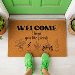 a welcome mat that says, welcome here, you like plants