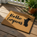 A textured door mat with the phrase "Hello Gorgeous" printed on it, along with a silhouette of a dog.