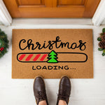a christmas loading mat with a christmas tree on it
