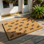 a brown doormat with the word "WOOF" written on it in a repeating pattern.