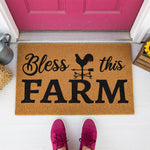 a door mat that says, bless this farm