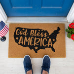 a door mat with the words god bless america on it