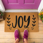 a door mat with the word joy on it