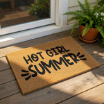 A textured area rug with the phrase "HOT GIRL SUMMER" printed on it.