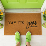 a door mat that says yay it's you