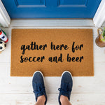a door mat that says gather here for soccer and beer