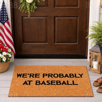a door mat that says, we're probably at baseball