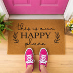 a door mat that says, this is our happy place