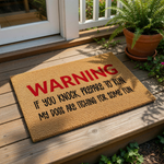a warning sign with the text "WARNING IF YOU KNOCK PREPARE TO RUN MY DOGS ARE TCHING FOR SOME FUN" in bold red letters.