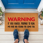 a door mat that says warning if you knock prepare to run, my dogs are