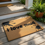 A textured area rug with the phrase "I love mud" printed on it.