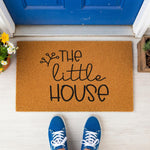 a door mat that says the little house