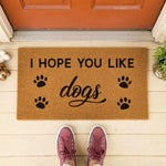 a door mat that says, i hope you like dogs
