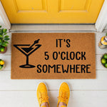 a door mat that says it's 50'clock somewhere