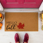 a door mat that says hello fall with a maple leaf
