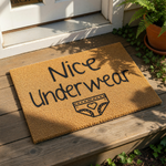 A textured area rug with the phrase " Nice Underwear" printed on it, along with a graphic of a underwear.