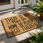 A wooden door mat with a humorous message that reads "THERE IS NO PLACE LIKE HOME SO PLEASE GO THERE!"