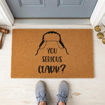 A door mat with a humorous text that reads "YOU SERIOUS CLARK?" printed on it.
