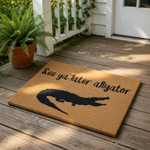 A black silhouette of an alligator on a beige background with the text "See ya later alligator" written above it.