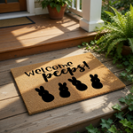 A mat with the text "Welcome peeps!" and four black bunny silhouettes.
